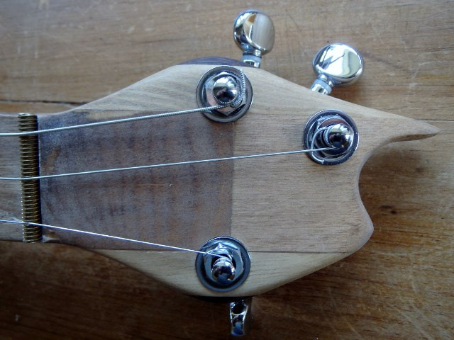 Yellow Montecristo cigar box guitar headstock by Wires and Wood