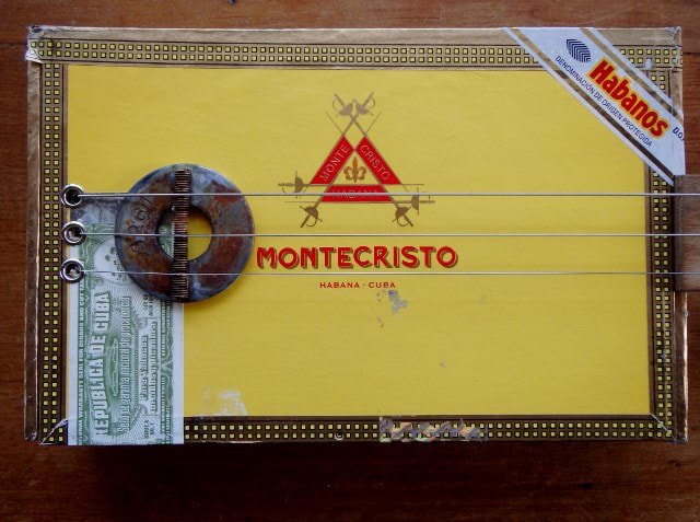 Yellow cigar box guitar by Wires and Wood